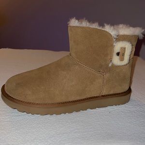 Brand new!! Never worn.  Size 11 Ugg ankle boots with fur accents